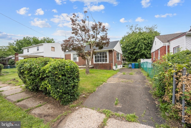 2301 Airacobra St, Levittown, PA 19057 - view of front facade with driveway and brick siding
