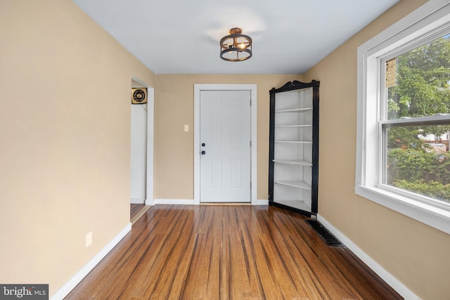 2301 Airacobra St, Levittown, PA 19057 - foyer entrance with wood finished floors, plenty of natural light, and a chandelier