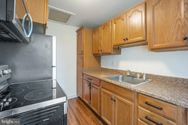 2301 Airacobra St, Levittown, PA 19057 - kitchen featuring appliances with stainless steel finishes, dark wood-style flooring, and light countertops