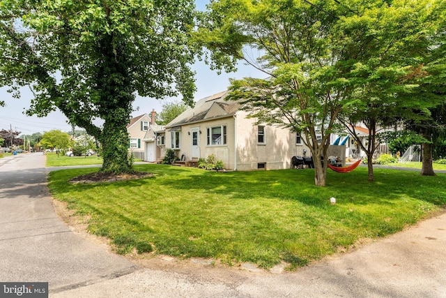 101 Ash Rd, Wallingford, PA 19086 - view of front of property featuring a front lawn and stucco siding