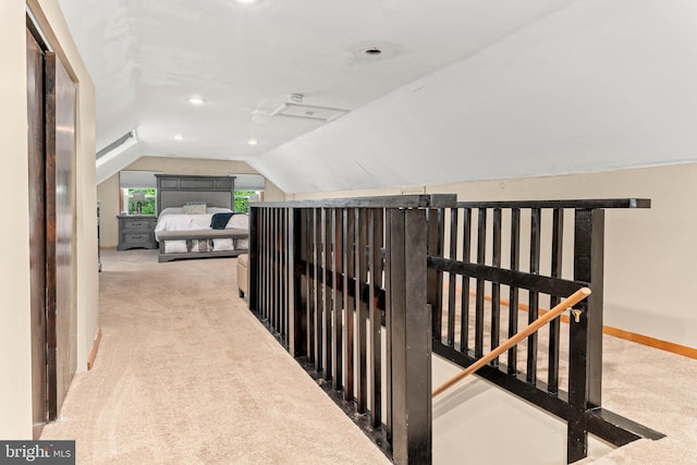 101 Ash Rd, Wallingford, PA 19086 - hallway with an upstairs landing, carpet flooring, vaulted ceiling, and recessed lighting