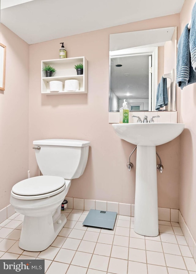 101 Ash Rd, Wallingford, PA 19086 - half bath featuring toilet and tile patterned floors
