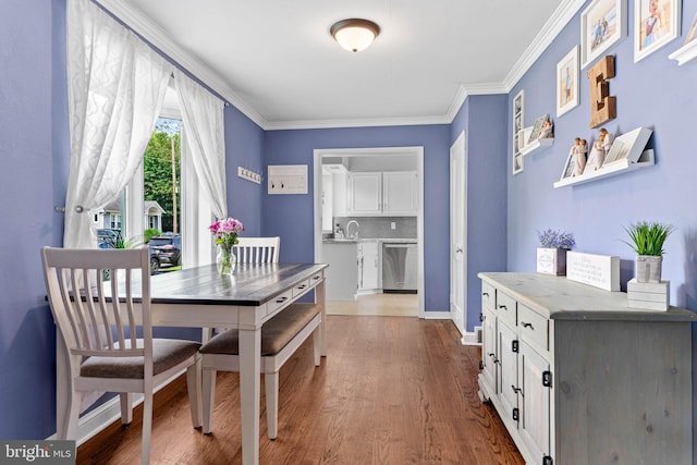 101 Ash Rd, Wallingford, PA 19086 - dining room featuring dark wood-style floors and ornamental molding