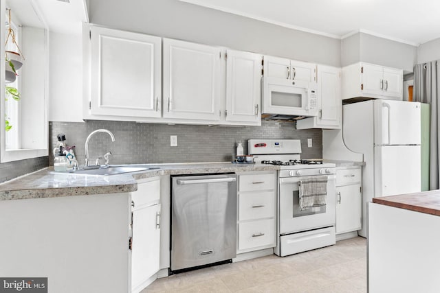 101 Ash Rd, Wallingford, PA 19086 - kitchen featuring white appliances, white cabinetry, backsplash, light countertops, and ornamental molding
