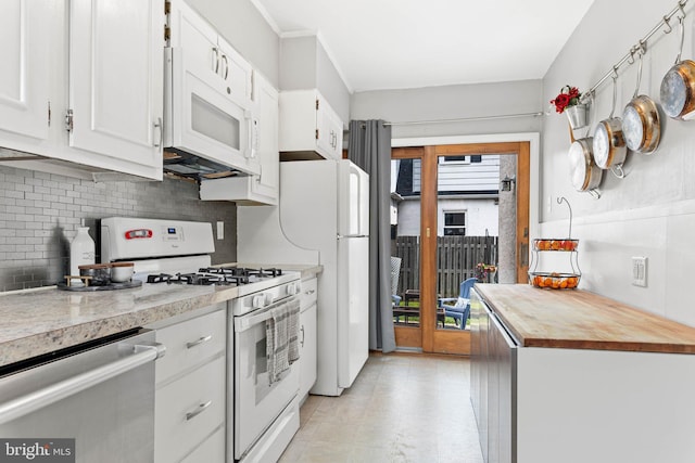 101 Ash Rd, Wallingford, PA 19086 - kitchen featuring white appliances, decorative backsplash, white cabinets, and wooden counters