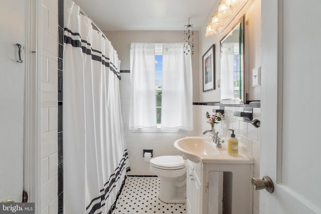 1931 Edgewood Rd, Towson, MD 21286 - full bathroom with tile walls, vanity, a shower with curtain, and wainscoting