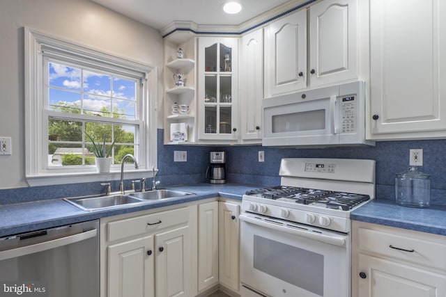 1931 Edgewood Rd, Towson, MD 21286 - kitchen with white appliances, white cabinetry, glass insert cabinets, and dark countertops