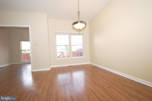 12013 Panthers Ridge Dr, Germantown, MD 20876 - spare room with plenty of natural light, dark wood-style floors, and lofted ceiling