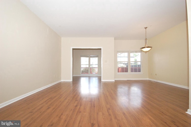 12013 Panthers Ridge Dr, Germantown, MD 20876 - unfurnished living room with wood finished floors and baseboards