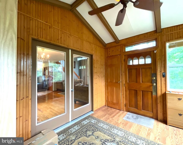 183 Radcliff Rd, Bushkill, PA 18324 - foyer entrance with wood walls, wood finished floors, a ceiling fan, and a chandelier