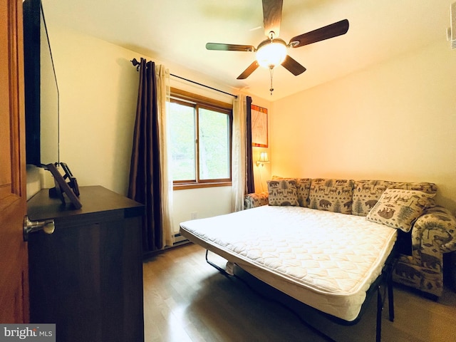 183 Radcliff Rd, Bushkill, PA 18324 - bedroom featuring wood finished floors, ceiling fan, and a baseboard radiator