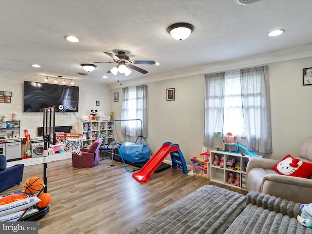 15 Nightingale St, Keyser, WV 26726 - playroom with a ceiling fan, crown molding, a textured ceiling, wood finished floors, and recessed lighting