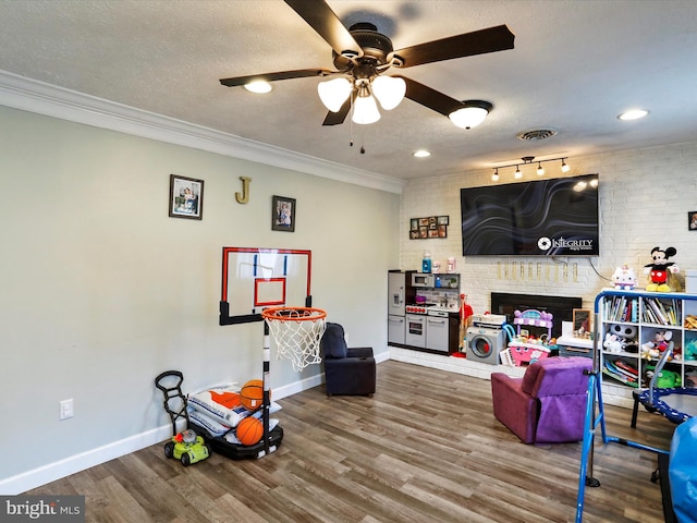 15 Nightingale St, Keyser, WV 26726 - recreation room with ceiling fan, wood finished floors, crown molding, a textured ceiling, and recessed lighting