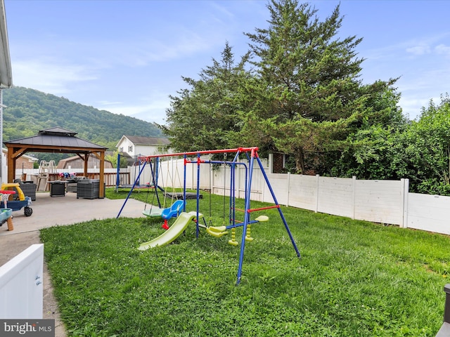 15 Nightingale St, Keyser, WV 26726 - view of jungle gym with a patio area, a gazebo, a mountain view, and a fenced backyard