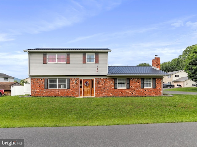 15 Nightingale St, Keyser, WV 26726 - colonial house featuring brick siding, a chimney, a front lawn, and a metal roof