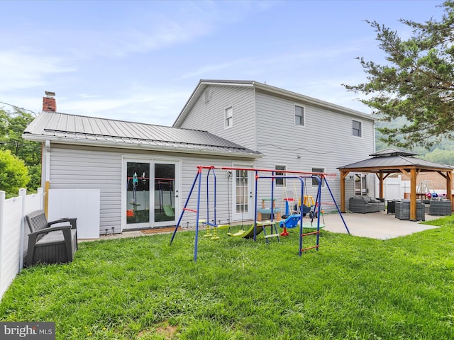 15 Nightingale St, Keyser, WV 26726 - rear view of house with a gazebo, a standing seam roof, outdoor lounge area, a patio area, and a chimney