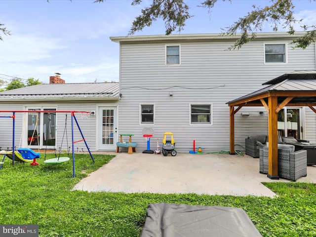 15 Nightingale St, Keyser, WV 26726 - rear view of house with outdoor lounge area, a gazebo, a patio area, a lawn, and a metal roof