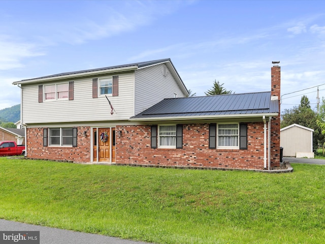 15 Nightingale St, Keyser, WV 26726 - view of front facade with a chimney, brick siding, and a front lawn