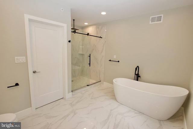 2417 N Hancock St, Philadelphia, PA 19133 - bathroom featuring a marble finish shower, marble finish flooring, a freestanding tub, and recessed lighting