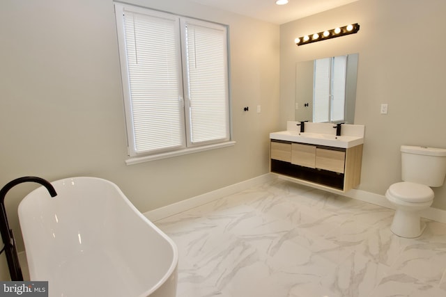 2417 N Hancock St, Philadelphia, PA 19133 - bathroom featuring double vanity, a freestanding tub, marble look tiles, and recessed lighting
