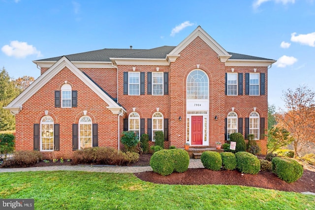 7904 Windsor Knoll Ln, Laytonsville, MD 20882 - colonial-style house with brick siding and a front lawn