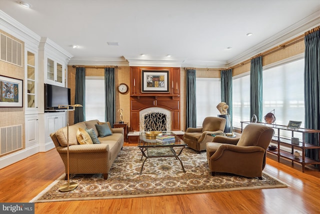 9858 Palace Green Way, Vienna, VA 22181 - living room with crown molding, wood finished floors, and a fireplace with raised hearth