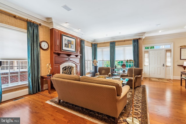 9858 Palace Green Way, Vienna, VA 22181 - living room with crown molding, a fireplace, and light wood-style floors