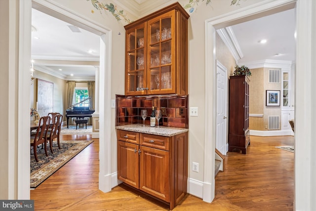 9858 Palace Green Way, Vienna, VA 22181 - bar with light wood-type flooring and ornamental molding