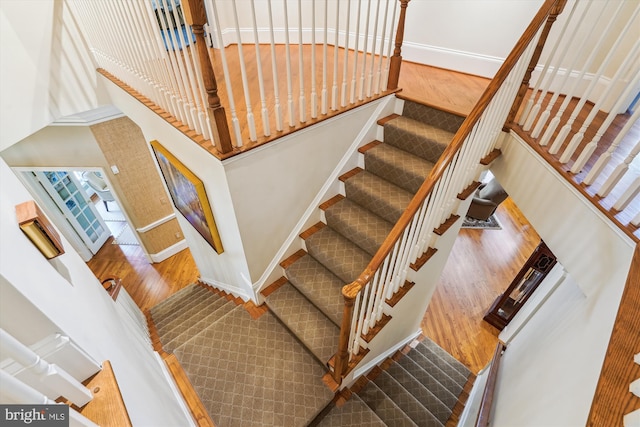 9858 Palace Green Way, Vienna, VA 22181 - staircase featuring wood finished floors and a towering ceiling