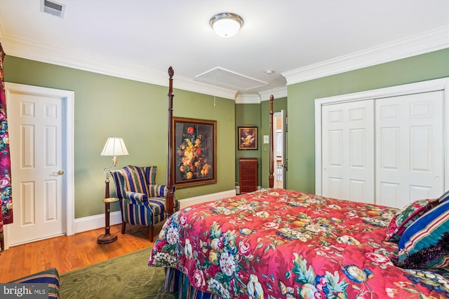 9858 Palace Green Way, Vienna, VA 22181 - bedroom with attic access, wood finished floors, crown molding, and a closet