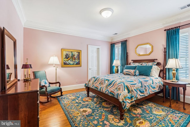 9858 Palace Green Way, Vienna, VA 22181 - bedroom with multiple windows, crown molding, and light wood finished floors