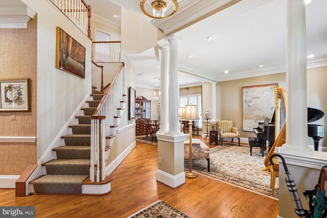 9858 Palace Green Way, Vienna, VA 22181 - stairs with ornate columns, wood finished floors, crown molding, and recessed lighting