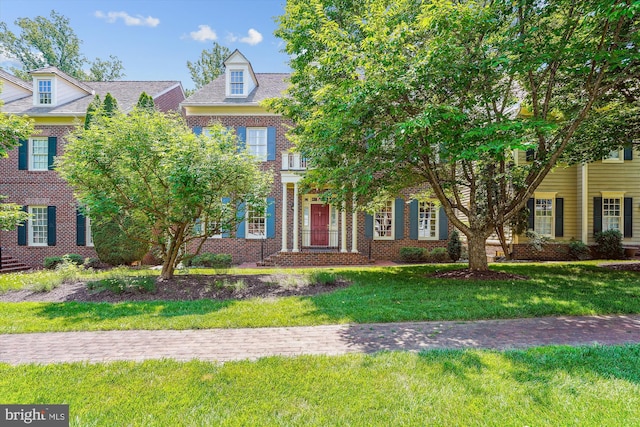 9858 Palace Green Way, Vienna, VA 22181 - colonial house with brick siding and a front lawn