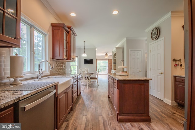 26294 Evesboro Ln, Eden, MD 21822 - kitchen with dishwasher, a kitchen island, ornamental molding, hanging light fixtures, and light stone counters