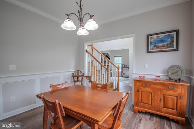 26294 Evesboro Ln, Eden, MD 21822 - dining space with stairway, crown molding, a chandelier, a wainscoted wall, and wood finished floors