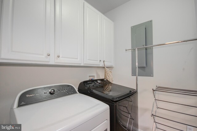 26294 Evesboro Ln, Eden, MD 21822 - laundry room with cabinet space, washing machine and dryer, and electric panel