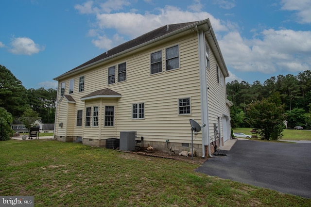 26294 Evesboro Ln, Eden, MD 21822 - back of property with an attached garage, asphalt driveway, a lawn, and crawl space