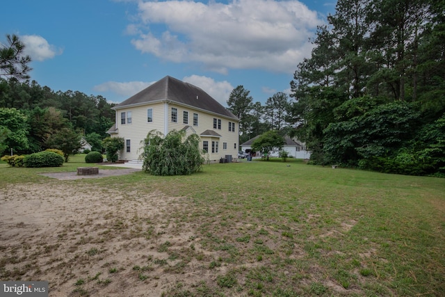 26294 Evesboro Ln, Eden, MD 21822 - rear view of house with a yard and a fire pit