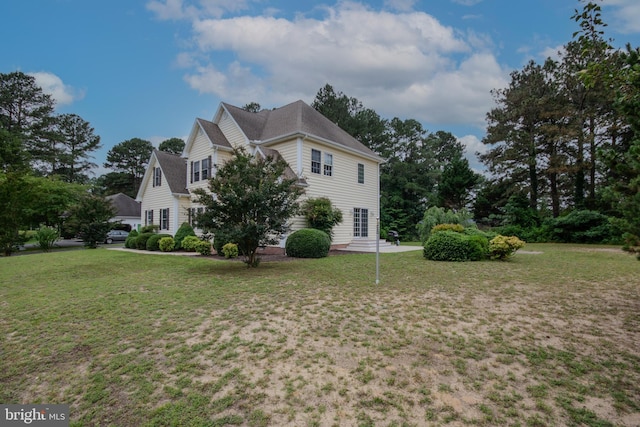 26294 Evesboro Ln, Eden, MD 21822 - view of property exterior featuring a yard and a patio area