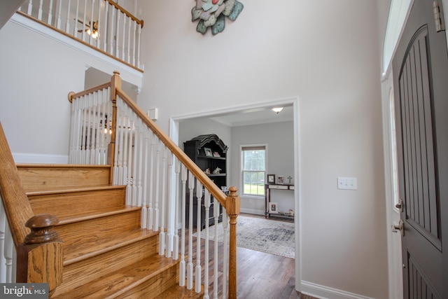 26294 Evesboro Ln, Eden, MD 21822 - entrance foyer with wood finished floors, a towering ceiling, and stairs