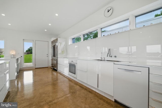 317 Clearview Ave, Nazareth, PA 18064 - kitchen featuring white appliances, white cabinets, finished concrete floors, recessed lighting, and modern cabinets