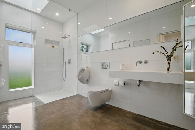 317 Clearview Ave, Nazareth, PA 18064 - bathroom featuring a walk in shower, concrete floors, and tile walls