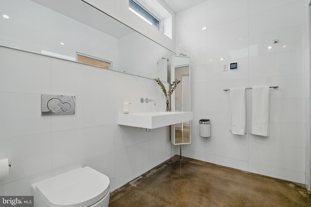 317 Clearview Ave, Nazareth, PA 18064 - bathroom featuring tile walls and concrete floors