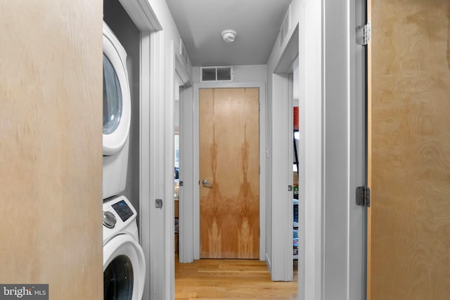 1800 S 16th St Unit B, Philadelphia, PA 19145 - laundry room featuring stacked washer / drying machine and wood finished floors