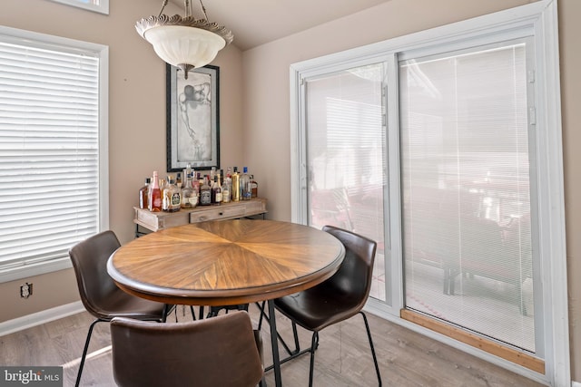 94 E Oak Ave, Lawnside, NJ 08045 - dining area with wood finished floors and a bar