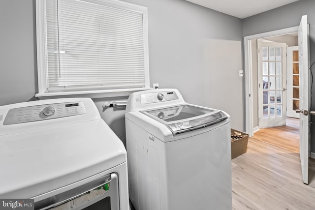 94 E Oak Ave, Lawnside, NJ 08045 - laundry room featuring washing machine and clothes dryer and light wood-style floors