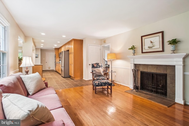 3010 Phyllmar Pl, Oakton, VA 22124 - living area featuring light wood-style flooring, a tiled fireplace, and recessed lighting