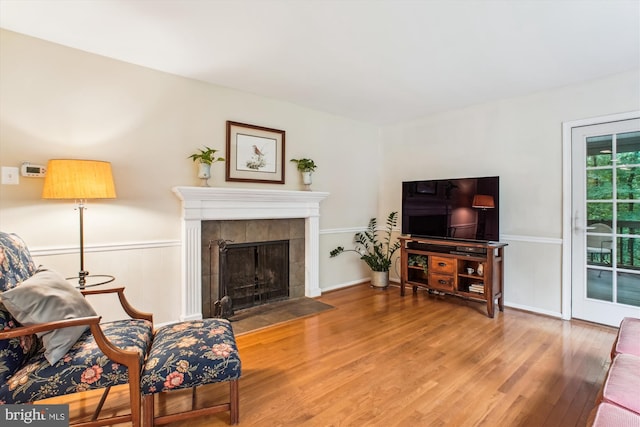 3010 Phyllmar Pl, Oakton, VA 22124 - living room featuring wood finished floors, a fireplace, and wainscoting