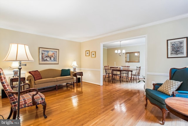 3010 Phyllmar Pl, Oakton, VA 22124 - living room featuring light wood-style flooring, crown molding, and a chandelier