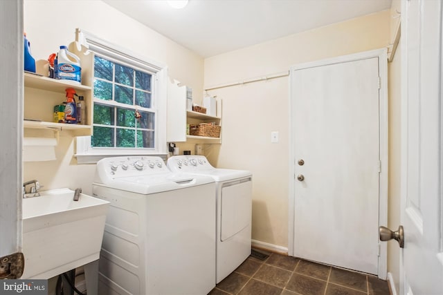 3010 Phyllmar Pl, Oakton, VA 22124 - laundry area featuring washing machine and clothes dryer and dark tile patterned flooring